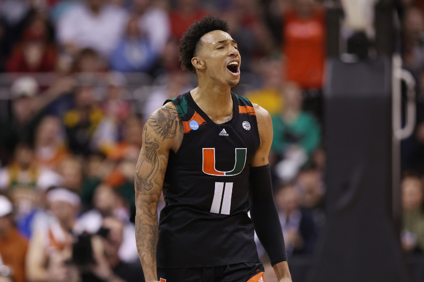 Jordan Miller #11 of the Miami Hurricanes celebrates during the second half against the Texas Longhorns in the Elite Eight round of the NCAA Men's Basketball Tournament 