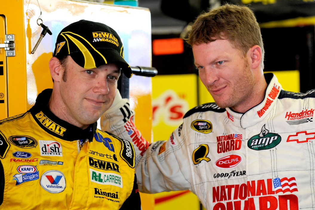 Matt Kenseth talks with Dale Earnhardt Jr. in the garage during practice for the 2008 Camping World RV 400 at Kansas Speedway