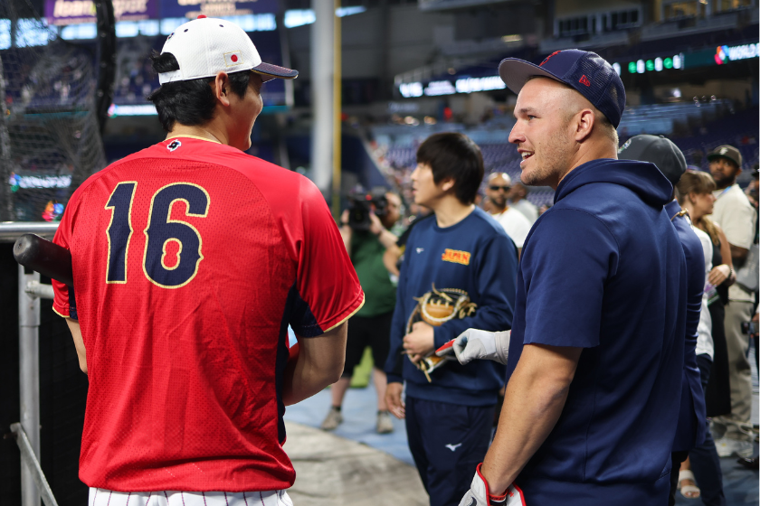 Shohei Ohtani #16 of Team Japan talks with Mike Trout #27 of Team USA during batting practice prior to the 2023 World Baseball Classic Championship game between Team USA and Team Japan at loanDepot Park 