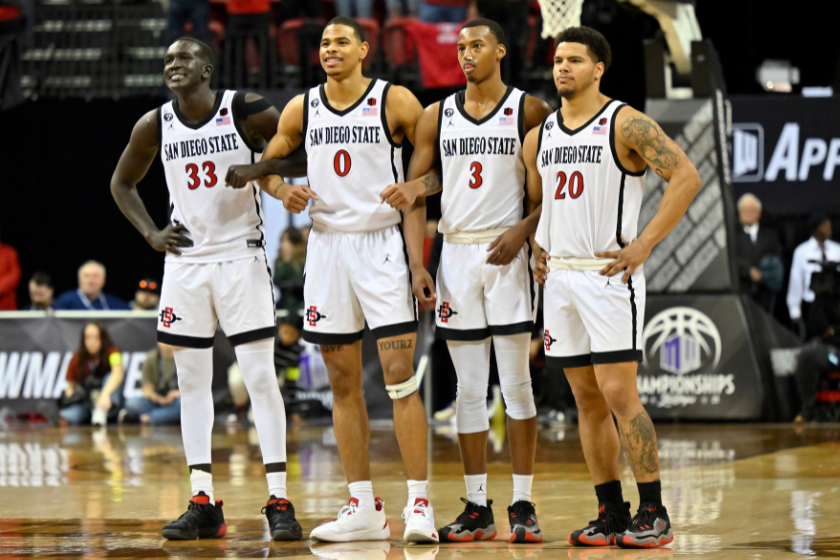 Aguek Arop #33, Keshad Johnson #0, Micah Parrish #3 and Matt Bradley #20 of the San Diego State Aztec sstand on the court during the second half of the championship game against the Utah State Aggies in the Mountain West Conference basketball tournament