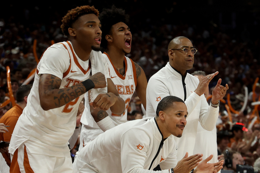 Arterio Morris #2, Dillon Mitchell #23, Assistant Coach Brandon Chappell and acting head coach Rodney Terry of the Texas Longhorns react to the action during the game with the Kansas Jayhawks 