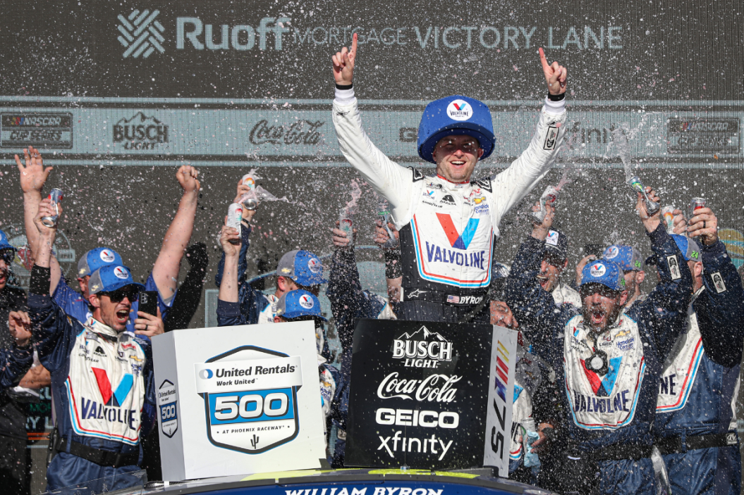 William Byron, driver of the #24 Valvoline Chevrolet, celebrates in victory lane after winning the NASCAR Cup Series United Rentals Work United 500 at Phoenix Raceway