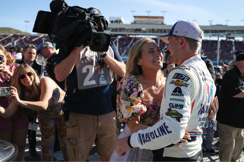 William Byron and Erin Blaney celebrate in victory lane after winning the 2023 United Rentals Work United 500 at Phoenix Raceway