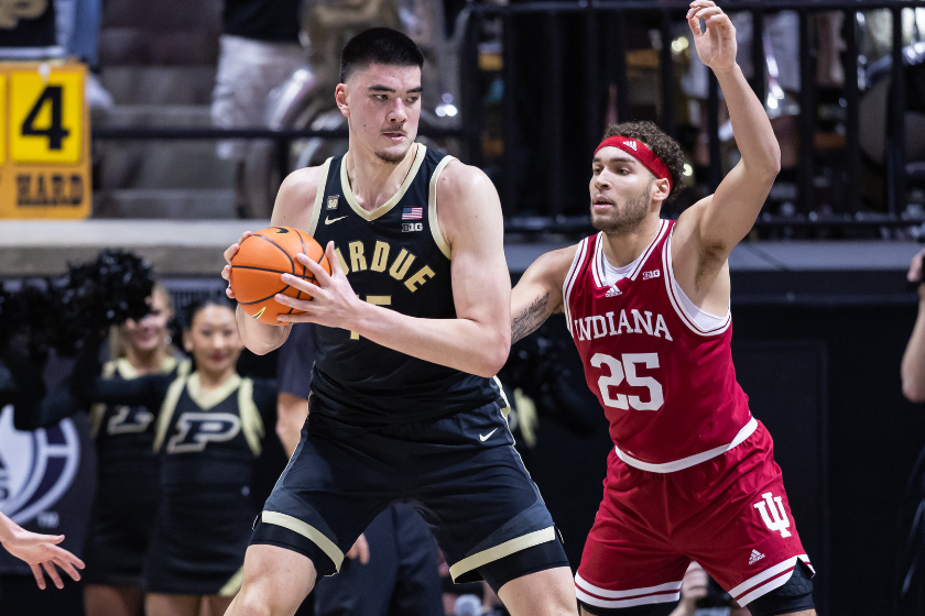Zach Edey #15 of the Purdue Boilermakers holds the ball against Race Thompson #25 of the Indiana Hoosiers at Mackey Arena