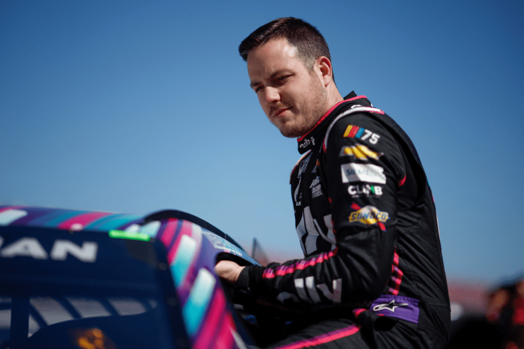 Alex Bowman enters his car during qualifying for the 2023 GEICO 500 at Talladega Superspeedway