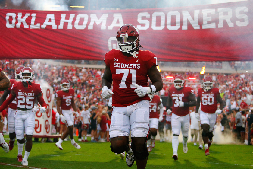 Left tackle Anton Harrison #71 of the Oklahoma Sooners runs onto the field for a game against the Kansas State Wildcats at Gaylord Family Oklahoma Memorial Stadium