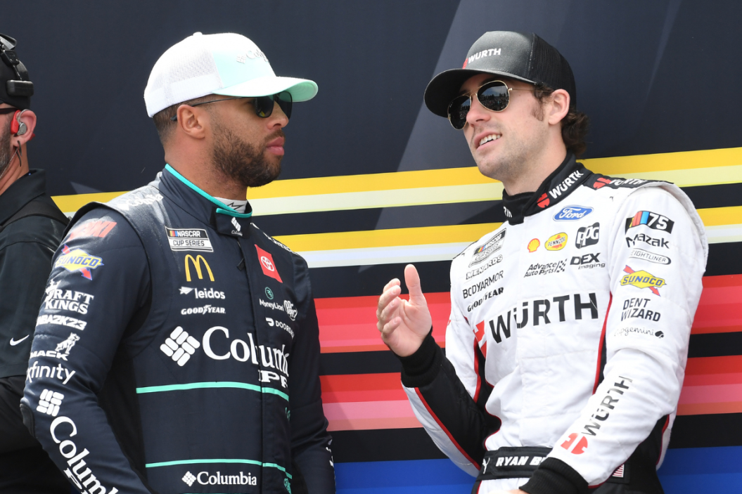 Bubba Wallace (#23 23XI Racing Columbia Sportswear Company Toyota) and Ryan Blaney (#12 Team Penske Wurth Ford) talk before the running of the NASCAR Cup Series Geico 500