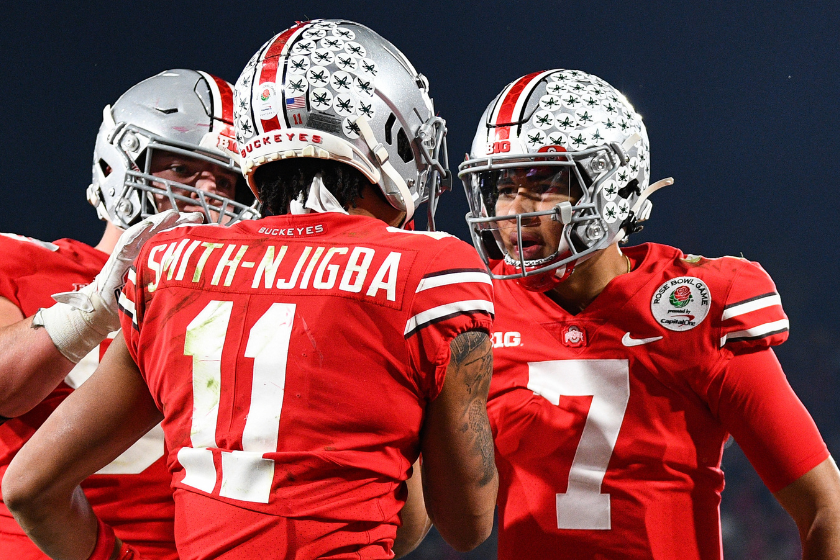 Ohio State Buckeyes quarterback C.J. Stroud (7) celebrates with Ohio State Buckeyes wide receiver Jaxon Smith-Njigba (11) after a touchdown during the Rose Bowl game between the Ohio State Buckeyes and the Utah Utes