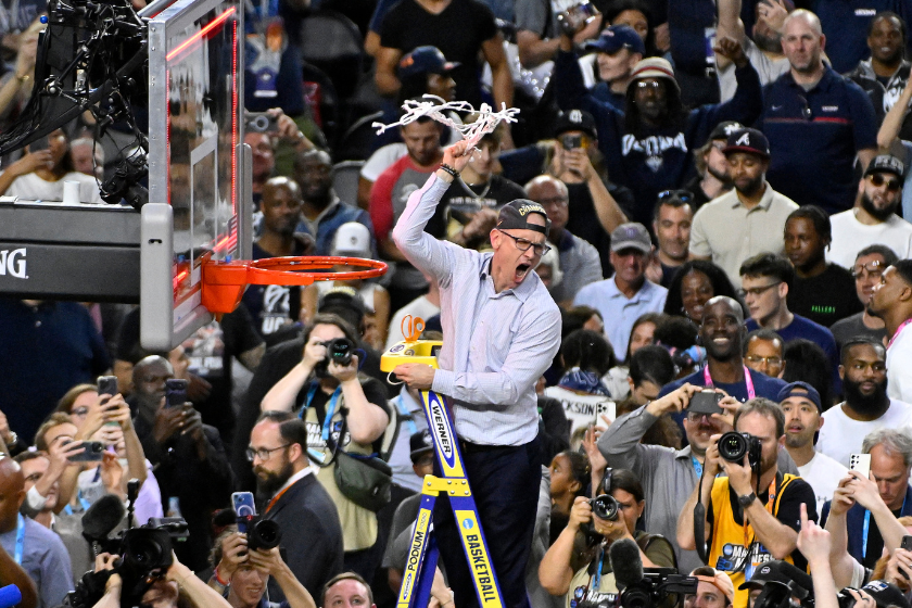 Head coach Dan Hurley of the Connecticut Huskies reacts as he cuts down the net after defeating the San Diego State Aztecs 76-59 during the NCAA Men's Basketball Tournament National Championship game at NRG Stadium