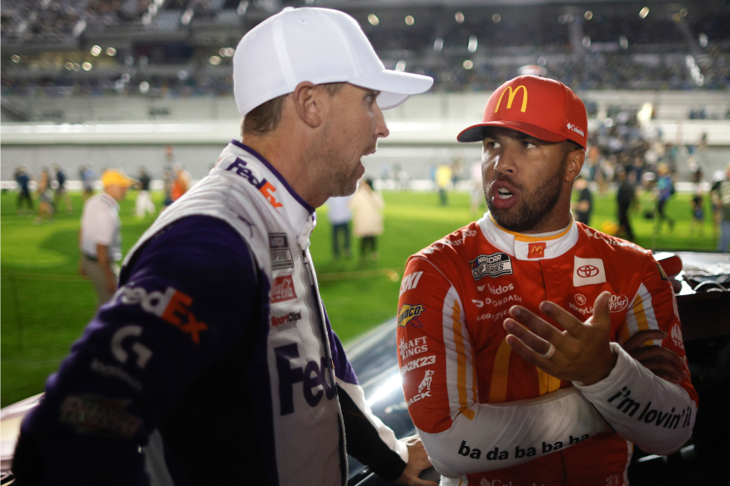Denny Hamlin speaks with Bubba Wallace on the grid prior to the 2023 Bluegreen Vacations Duel #1 at Daytona International Speedway