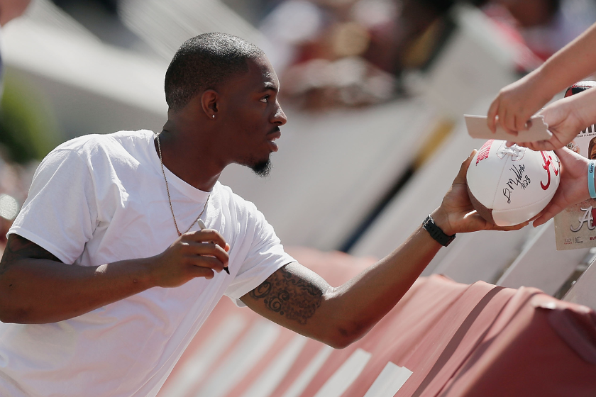Former Alabama player HaHa Clinton-Dix signs autographs the University of Alabama A-Day spring game at Bryant-Denny Stadium