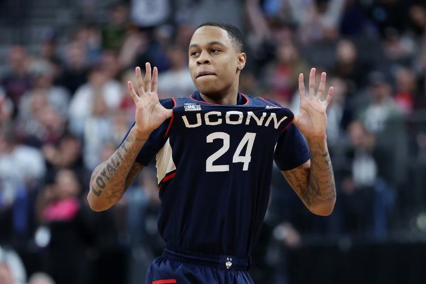 Jordan Hawkins #24 of the Connecticut Huskies celebrates after making a three point basket during the second half against the Gonzaga Bulldogs in the Elite Eight round of the NCAA Men's Basketball Tournament