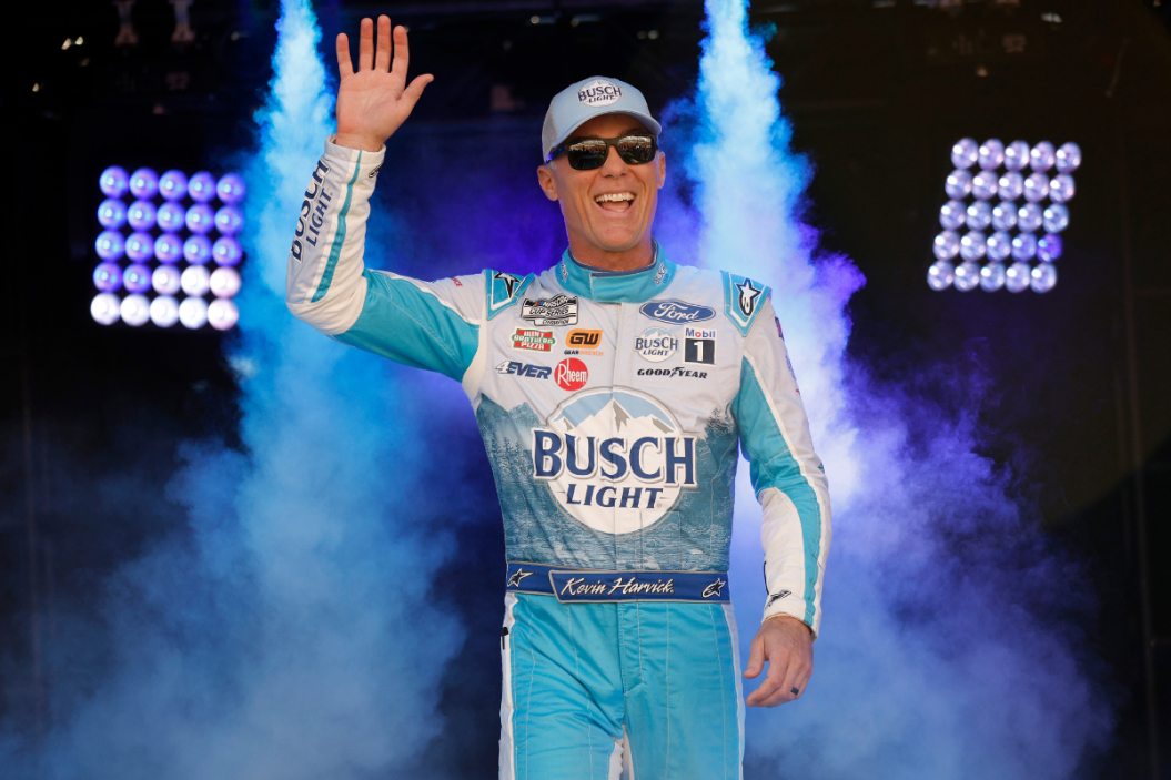 Kevin Harvick waves to fans as he walks onstage during driver intros prior to the 2023 Food City Dirt Race at Bristol Motor Speedway