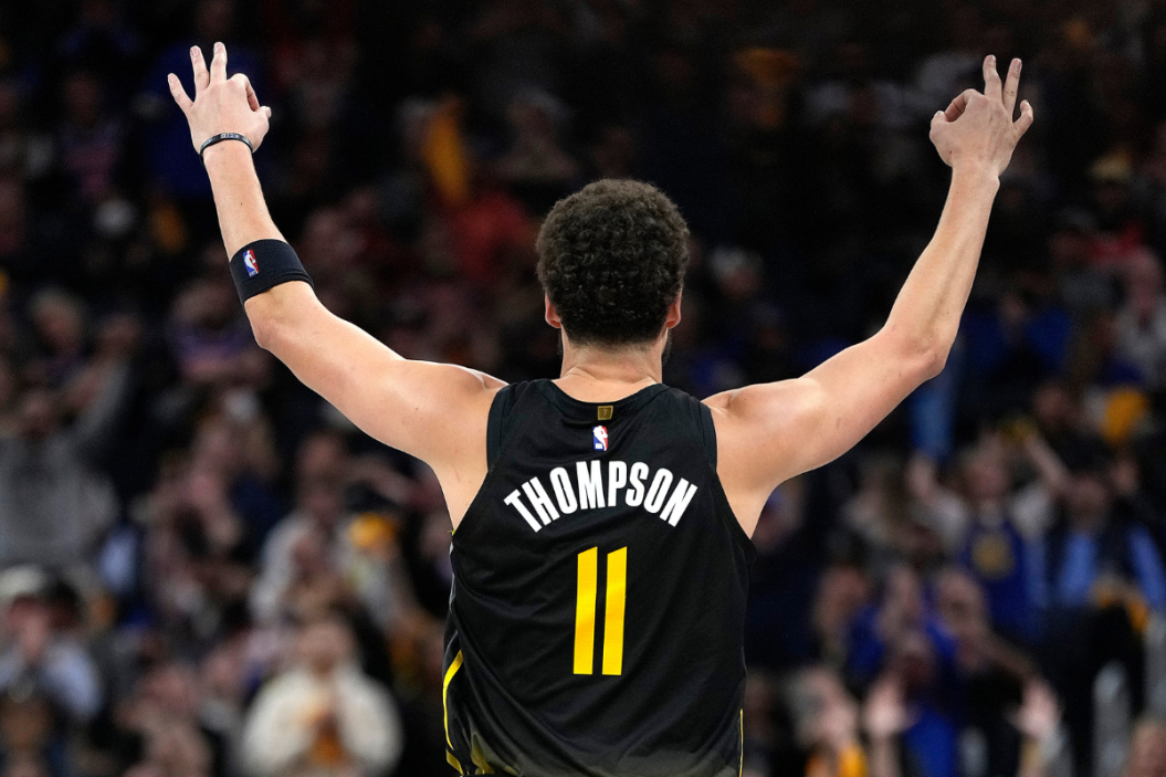 Klay Thompson #11 of the Golden State Warriors celebrates after he made a three-point shot against the New York Knicks during the fourth quarter of an NBA basketball game