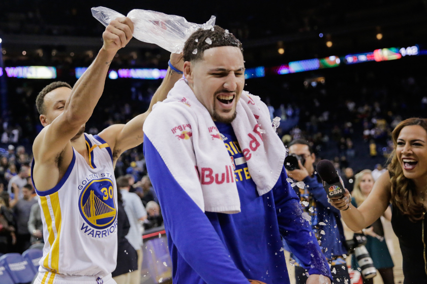 Golden State Warriors' Stephen Curry, #30 pours ice on teammate Klay Thompson, #11, after Klay scored a personal record of 60 points in a game against the Indiana Pacers