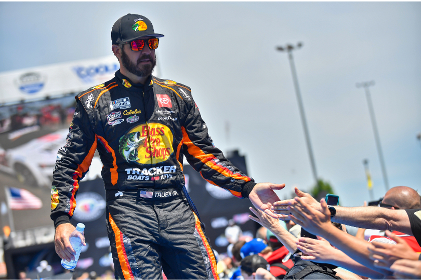 Martin Truex Jr. greets fans during driver introductions before the 2023 GEICO 500 at Talladega Superspeedway