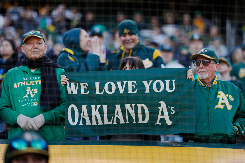 Oakland Athletics fans hold up a banner during the game between the Los Angeles Angels and the Oakland Athletics at RingCentral Coliseum