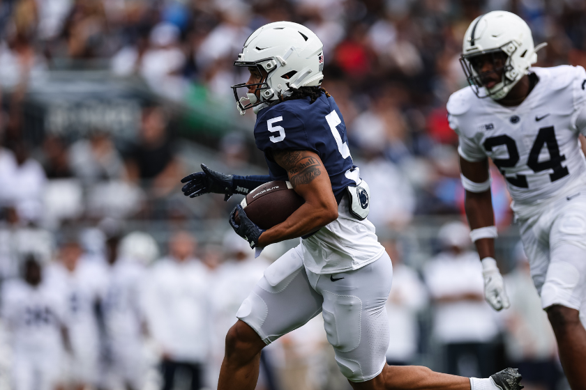 Omari Evans #5 of the Penn State Nittany Lions catches a pass for a touchdown in front of TaMere Robinson #24 during the Penn State Spring Football Game at Beaver Stadium