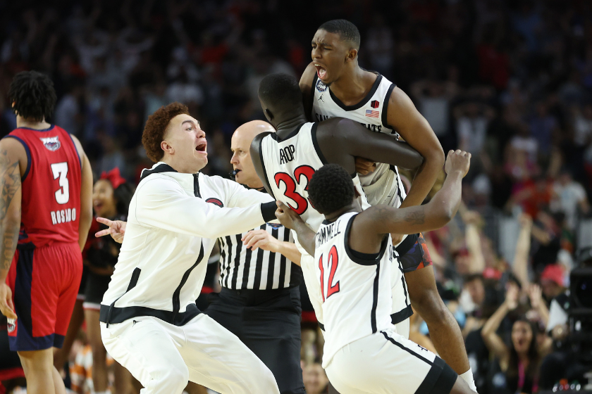  Lamont Butler #5 of the San Diego State Aztecs celebrates with teammates after making a game winning basket to defeat the Florida Atlantic Owls 72-71 during the NCAA Men's Basketball Tournament Final Four semifinal game