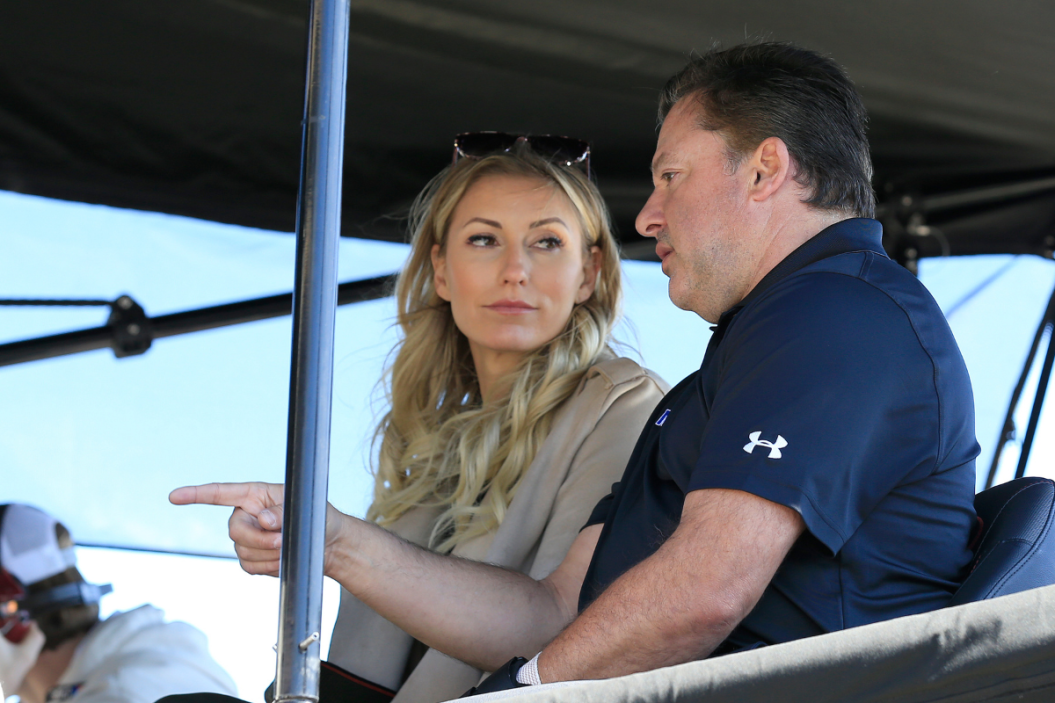 Tony Stewart talks with wife Leah Pruett during the 2022 QuikTrip 500 at Atlanta Motor Speedway