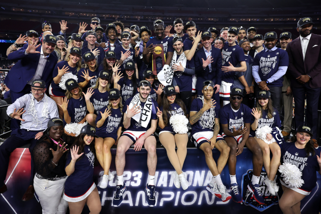 The Connecticut Huskies pose with the championship trophy after defeating the San Diego State Aztecs 76-59 during the NCAA Men's Basketball Tournament National Championship game at NRG Stadium