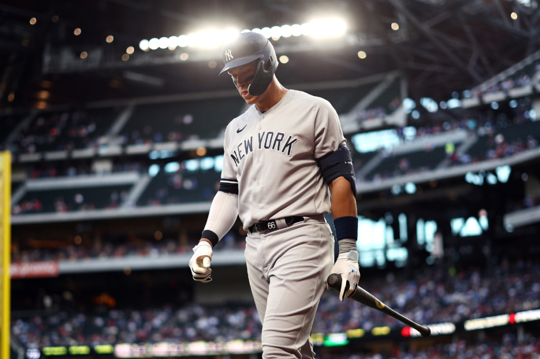 Aaron Judge #99 of the New York Yankees reacts after striking out against the Texas Rangers in the top of the second inning at Globe Life Field
