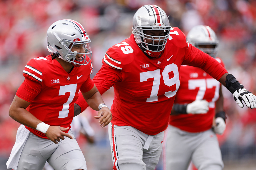 Ohio State Buckeyes offensive lineman Dawand Jones (79) congratulates quarterback C.J. Stroud (7) after a touchdown pass in the second quarter of a college football game against the Rutgers Scarlet Knights