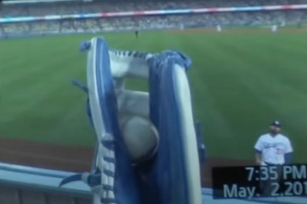 A Dodgers fan films himself catching a home run ball.