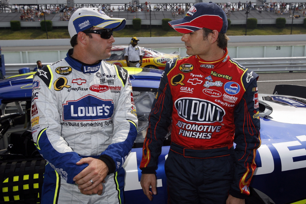 Jimmie Johnson and Jeff Gordon talk with each other on the grid during qualifying for the 2007 Pennsylvania 500 at Pocono Raceway