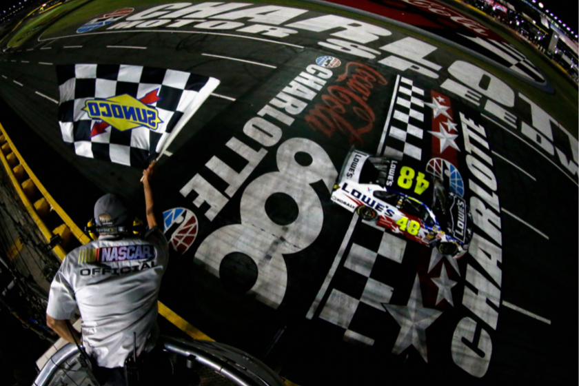 Jimmie Johnson takes the checkered flag to win the 2014 Coca-Cola 600 at Charlotte Motor Speedway