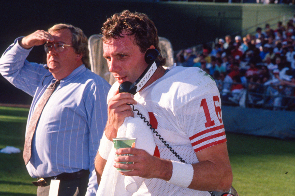 Jerry Rice of the San Francisco 49ers on the sidelines talking