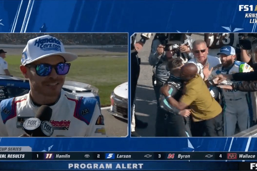 Kyle Larson gets interviewed after Kansas Speedway race while Noah Gragson and Ross Chastain fight on pit road