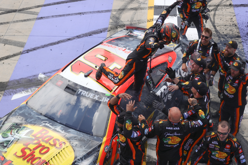 Martin Truex Jr. and crew celebrate after winning the 2023 Wu?rth 400 at Dover International Speedway