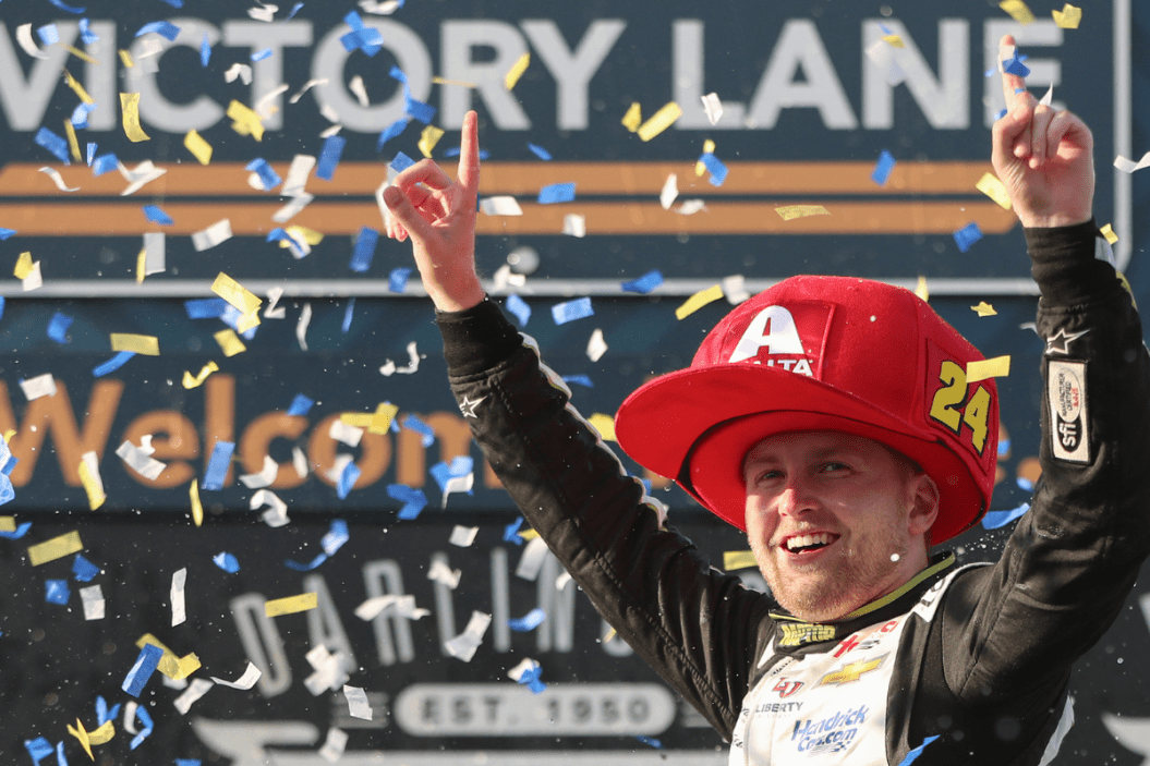 William Byron celebrates in victory lane after winning the 2023 Goodyear 400 at Darlington Raceway
