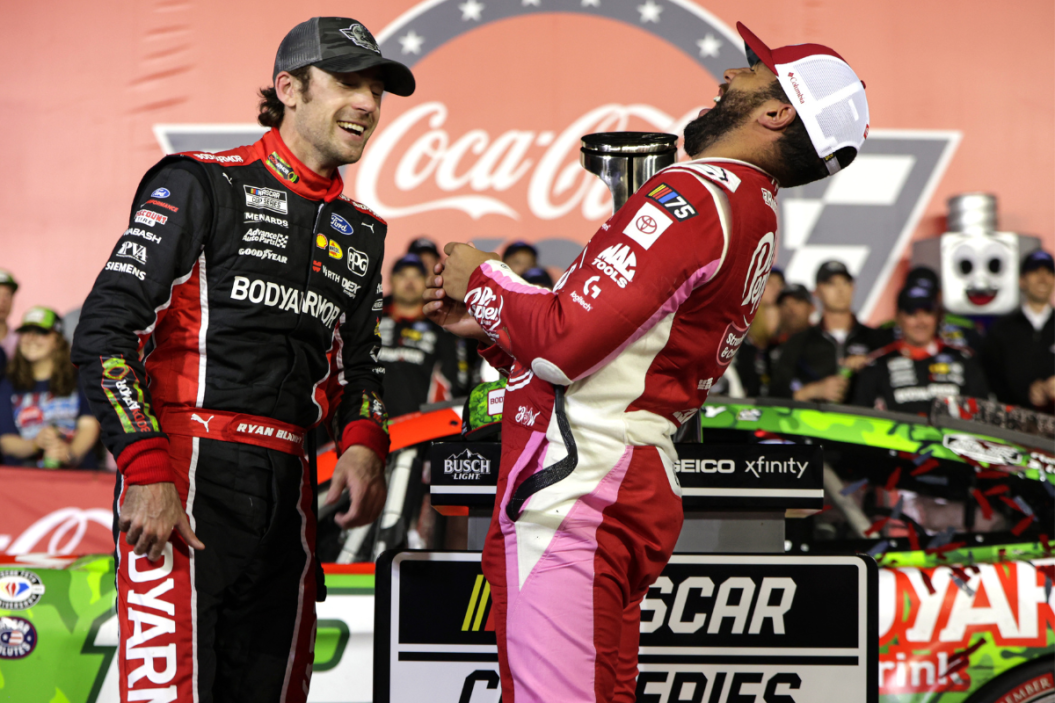 Bubba Wallace congratulates Ryan Blaney in victory lane after Blaney won the 2023 Coca-Cola 600 at Charlotte Motor Speedway