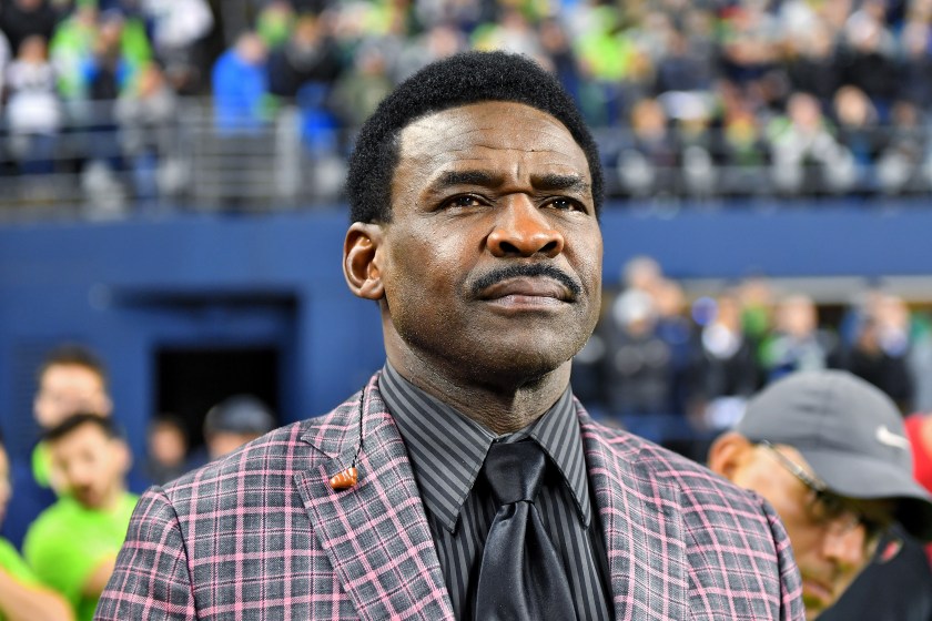 Michael Irvin looks on during a game.