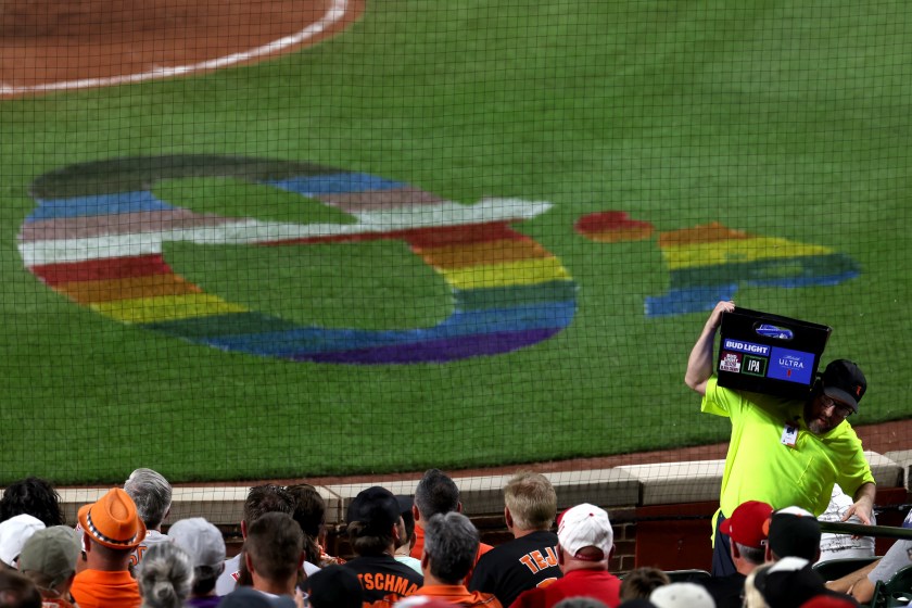 A rainbow logo for the Orioles is shown on the field.