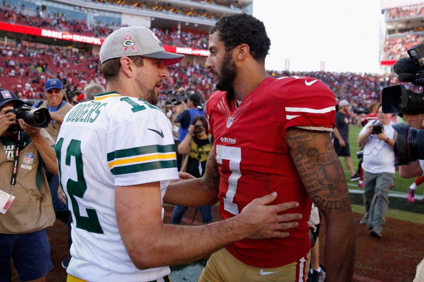 Colin Kaepernick and Aaron Rodgers talk to each other.