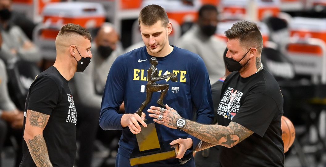 Nikola Jokic stands with his two older brothers.