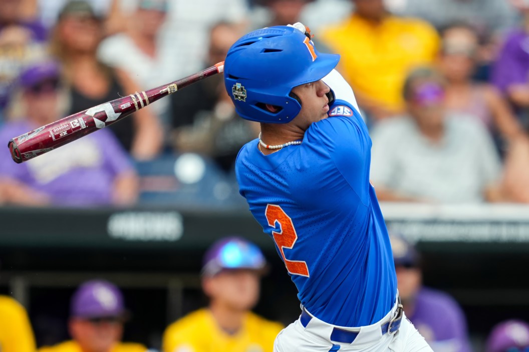 OMAHA, NEBRASKA - JUNE 25: Ty Evans #2 of the Florida Gators hits a home run against the LSU Tigers during the second inning of Game 2 of the NCAA College World Series baseball finals at Charles Schwab Field on June 25, 2023 in Omaha, Nebraska.