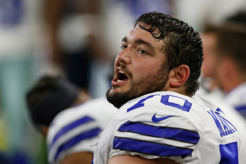Dallas Cowboys guard Zack Martin sits on the sideline. 
