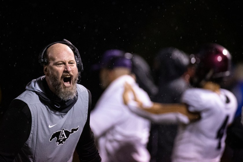 Trent Dilfer yells during a high school football game.
