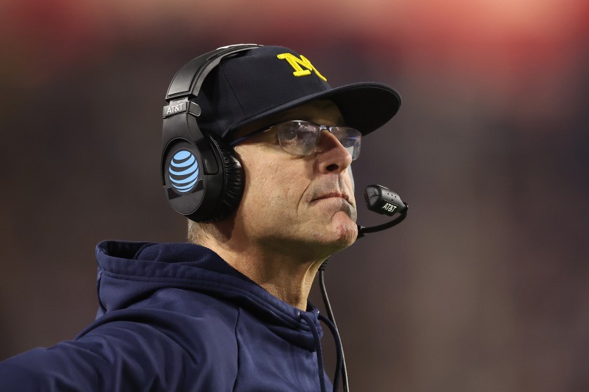 Michigan Wolverines head coach Jim Harbaugh looks away while on the sideline.