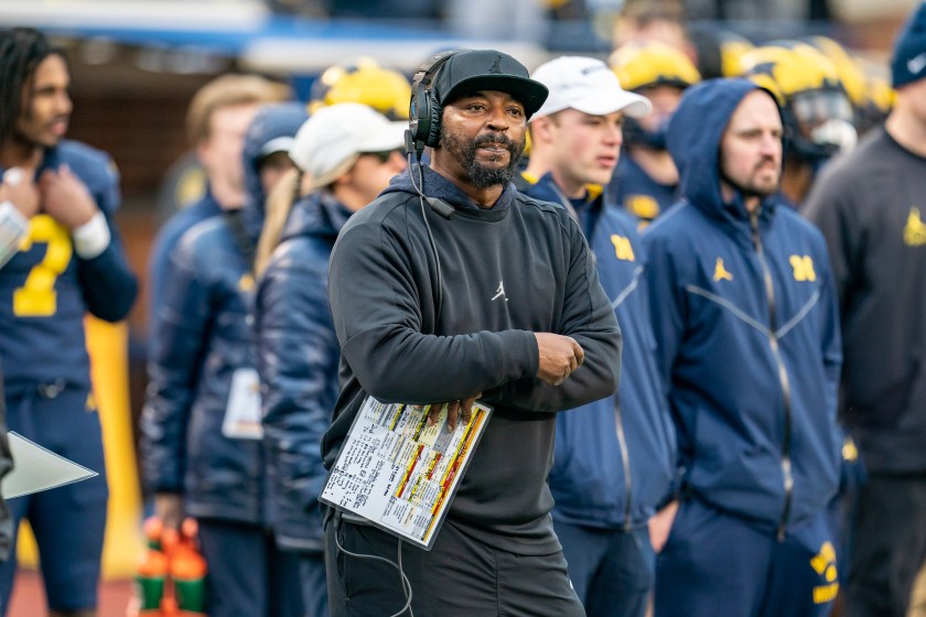 Michigan's Steve Clinkscale crosses his arms on the sideline.