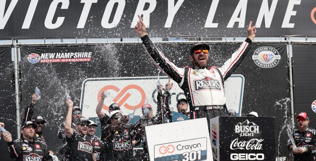NASCAR driver Martin Truex Jr. celebrates the Crayon 301 victory.