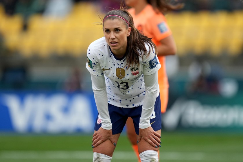 Alex Morgan rests her hands on her knees during a world cup match.