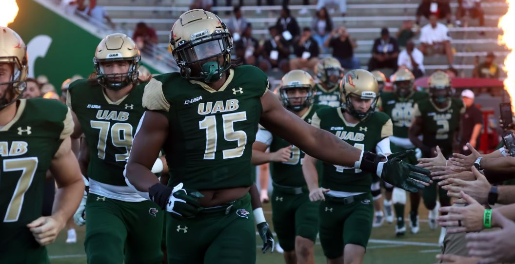 UAB football runs out during a 2022 game.