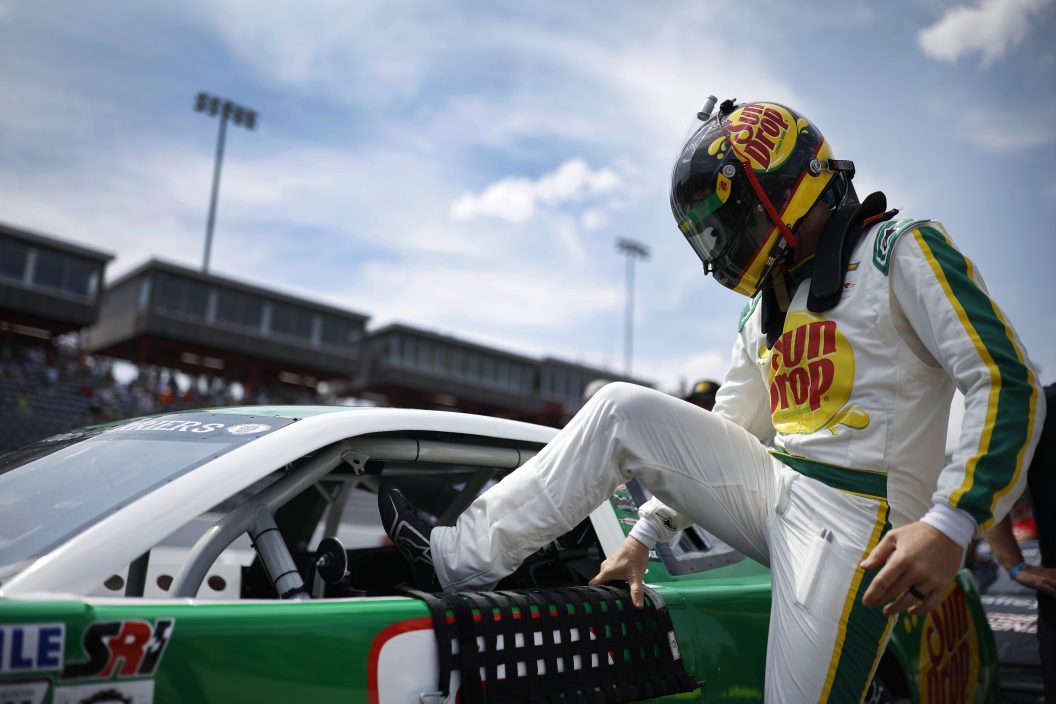 NORTH WILKESBORO, NORTH CAROLINA - MAY 17: Dale Earnhardt Jr., driver of the #3 Sun Drop Chevrolet, climbs into his car during qualifying for the CARS Late Model Stock Car Tour Window World 125 at North Wilkesboro Speedway on May 17, 2023 in North Wilkesboro, North Carolina.