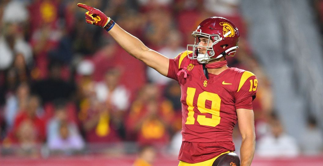 A USC wide receiver points after a first down.