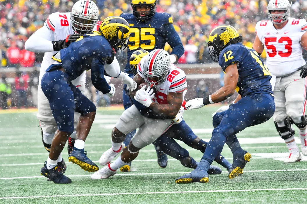 ANN ARBOR, MI - NOVEMBER 27: Ohio State Buckeyes running back Miyan Williams (28) bulls forward for a first down during The Michigan Wolverines vs the Ohio State Buckeyes game on Saturday November 27, 2021 at Michigan Stadium in Ann Arbor, MI.